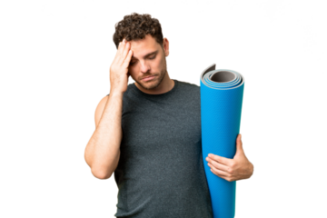 Young sport man going to yoga classes while holding a mat over isolated chroma key background with headache