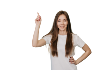 Pretty blonde caucasian young woman in white t-shirt with loose hair points up at empty space by index finger, smiles wide. Cute Italian girl looking at camera over transparent background, discount