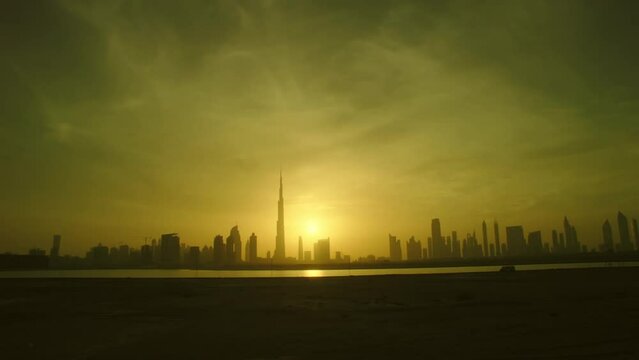 Dubai skyline timelapse from evening to night . Panoramic city view  with dynamic sky