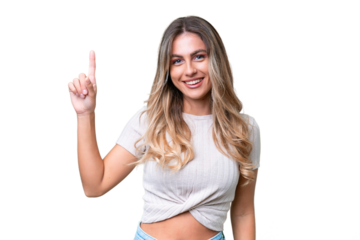 Young Uruguayan woman over isolated background pointing up a great idea