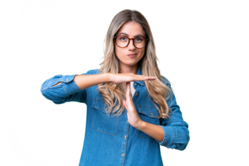 Young Uruguayan woman over isolated background making time out gesture
