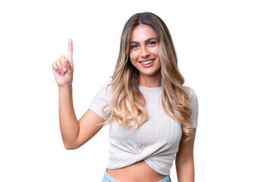 Young Uruguayan woman over isolated background pointing up a great idea