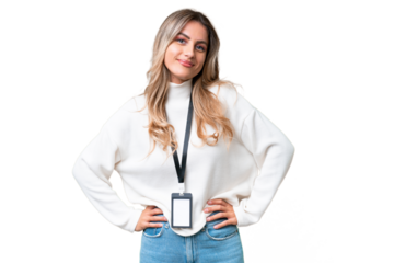 Young Uruguayan woman with ID card over isolated background posing with arms at hip and smiling