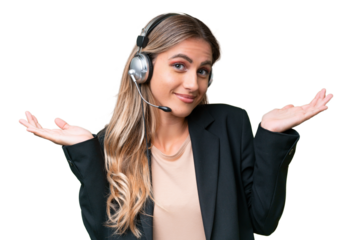 Telemarketer pretty Uruguayan woman working with a headset over isolated background having doubts while raising hands