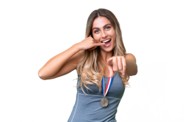 Young pretty sport Uruguayan woman with medals over isolated background making phone gesture and pointing front