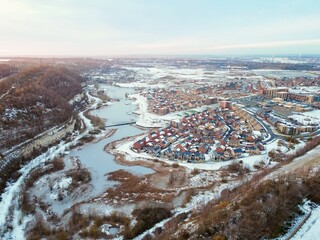 Aerial drone. Ebbsfleet garden city in Kent, covered in snow in December 2022. Aerial view of new...