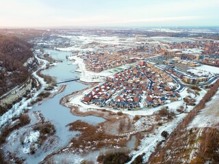 Aerial drone. Ebbsfleet garden city in Kent, covered in snow in December 2022. Aerial view of new...