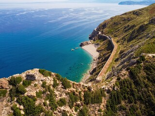 Aerial drone. Capo Calava bay and beach, with several holiday parks, resort and villages, near Gioiosa Marea, Sicily, Italy.