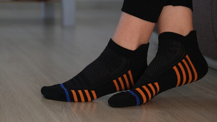 close-up black and striped ankle socks