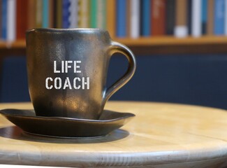 Coffee mug with text LIFE COACH ,refers to those who professionally trained to help maximize full...
