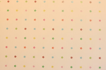 Multi Colored Stars On A Beige Background Wallpaper