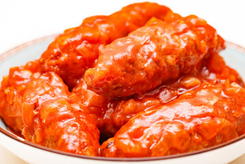 Lula kebab meat with tomato sauce close-up, selective focus