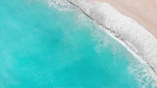 Aerial view of beautiful empty beach in Greece, no people. Dramatic coastline scenic bay rocky cliffs in the Ionian island, Port Katsiki, Lefkada. Blue turquoise waving sea.