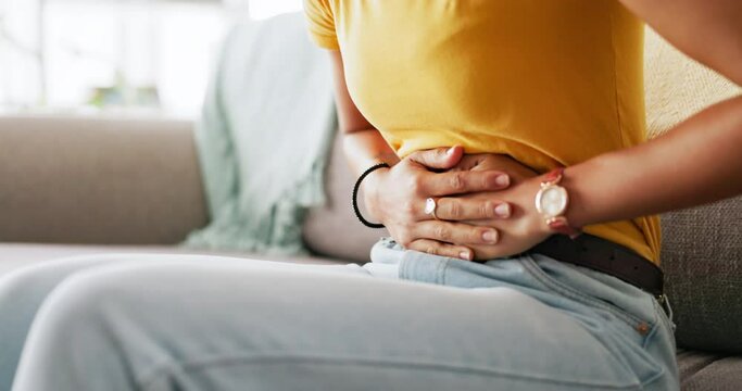 Pain, period and hands of woman on stomach holding belly for cramps, ache and menstruation problem. Health, endometriosis and hurt girl with hand on abdomen for pms, menstrual ache and digestion