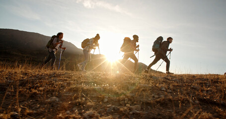 Four young people on hike adventure - Group of students trekking in mountains together, having a...