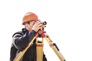A worker in an orange helmet measures the level on a white isolated background. Geodetic measurements before embarking on major construction projects. Elevation mark in construction work.