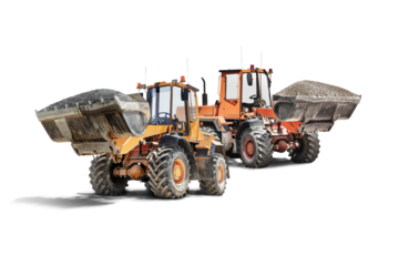 Two large wheel loaders with crushed stone or gravel in a bucket at a construction site. Transportation of bulk materials. Rental of construction equipment. Isolated loader on a white background.