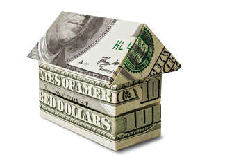 The house is stacked of dollar bills on a white isolated background. Element for design. Buying and...