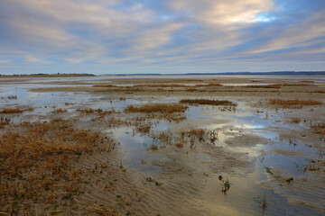 View accross Holy Island Causeway looking towards Lidisfarne on a Winters Day. Northumberland, England, UK.