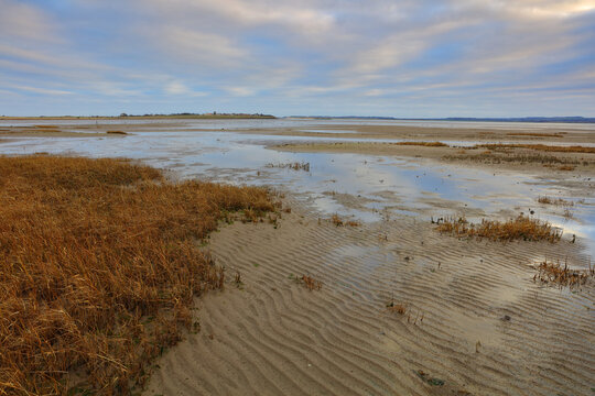 View accross Holy Island Causeway looking towards Lidisfarne on a Winters Day. Northumberland, England, UK.