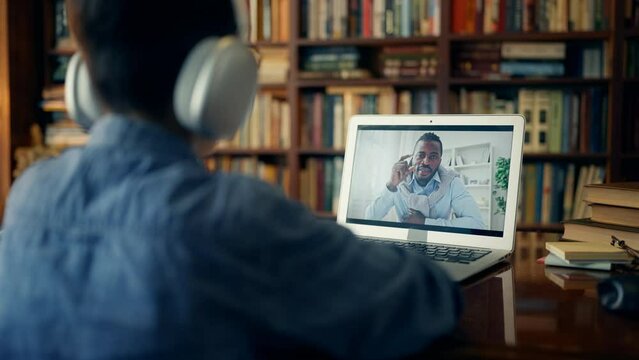Boy talking with foreign language teacher via video call, distance education