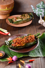 An Indoneisan traditional rice that is wrapped with banana leaves and grilled with Indonesian style
