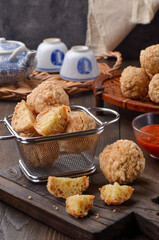 Bakwan Goreng or Cah Yen is Chinese street food made from flour and chopped chicken and prawns, shaped into rounds and fried and eaten with chili sauce.
