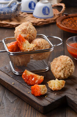 Bakwan Goreng or Cah Yen is Chinese street food made from flour and chopped chicken and prawns, shaped into rounds and fried and eaten with chili sauce.
