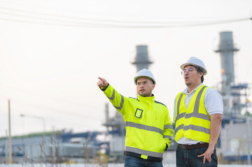 Group Asian man petrochemical engineer working at oil and gas refinery plant industry factory,The...