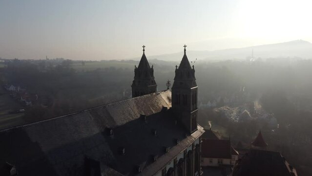 A monastery that looks like Hogwarts which is located in Schw&auml;bisch Hall and is called Comburg Monastery. It could also be a castle or a palace
