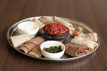 Eritrean dish called Kitfo served with spinach, cheese and flatbread