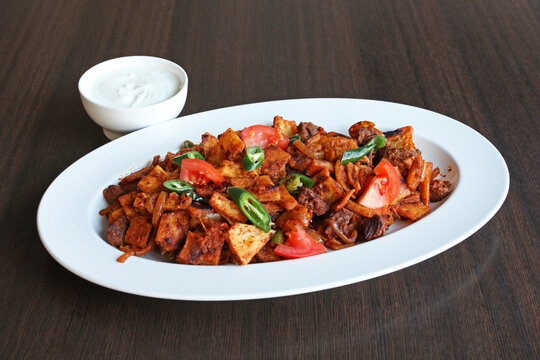 Eritrean vegetarian dish called Kicha served with cream