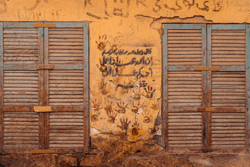 Handprints on Yellow House, Aswan Egypt