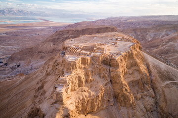 Fototapeta na wymiar Masada. The ancient fortification in the Southern District of Israel. Masada National Park in the Dead Sea region of Israel. The fortress of Masada. Drone Point of View.