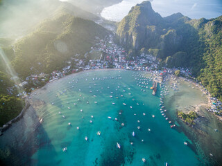 El Nido, Palawan, Philippines. Sunrise Light with Boats on Water.