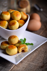 A Pineapple cookies baked for celebrating family time and tradition isolated on wooden table
