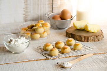 A Pineapple cookies baked for celebrating family time and tradition isolated on wooden table
