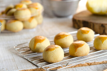 A Pineapple cookies baked for celebrating family time and tradition isolated on wooden table
