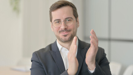 Portrait of Businessman Clapping in Appreciation