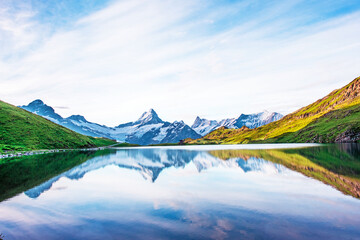 Breathtaking beautiful scenery on the lake in the Swiss Alps. Wetterhorn, Schreckhorn,...