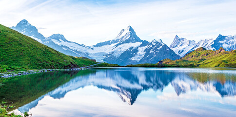Breathtaking beautiful scenery on the lake in the Swiss Alps. Wetterhorn, Schreckhorn, Finsteraarhorn et Bachsee. Exciting places. (relaxation, harmony, anti-stress - concept).