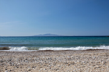 Fototapeta na wymiar Various colourful pebbles at the beautiful beach of Kambaki in Ios Greece