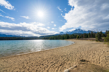Lake Annette lake shore beach, Jasper National Park stunning nature scenery in summer time. Landscape of Canadian Rockies, Alberta, Canada.