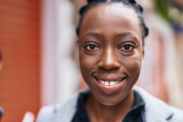 Obraz premium African american woman smiling confident standing at street