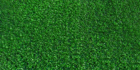 Fototapete Gras Green grass background, banner. Turf, soccer field, green grass artificial turf, texture, top view. summer lawn background