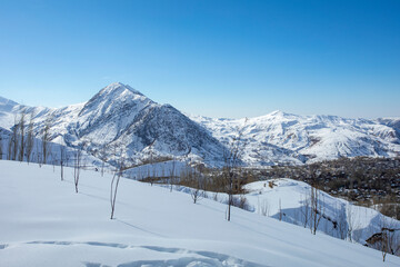 Fototapeta na wymiar Steep mountain slopes and pure snow