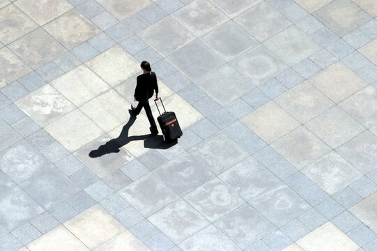 Businesswoman walking across a square