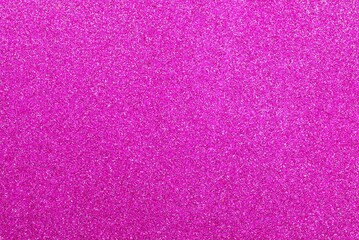 Fuchsia shimmer background with reflective glitter material