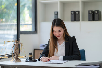 Lawyer businesswoman working and notary signs the documents at the office. consultant lawyer, justice and law, attorney, court judge, concept.