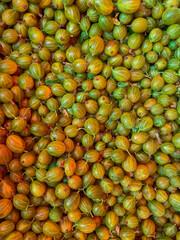 lots of ripe gooseberries vitamins delicious food healthy food as background